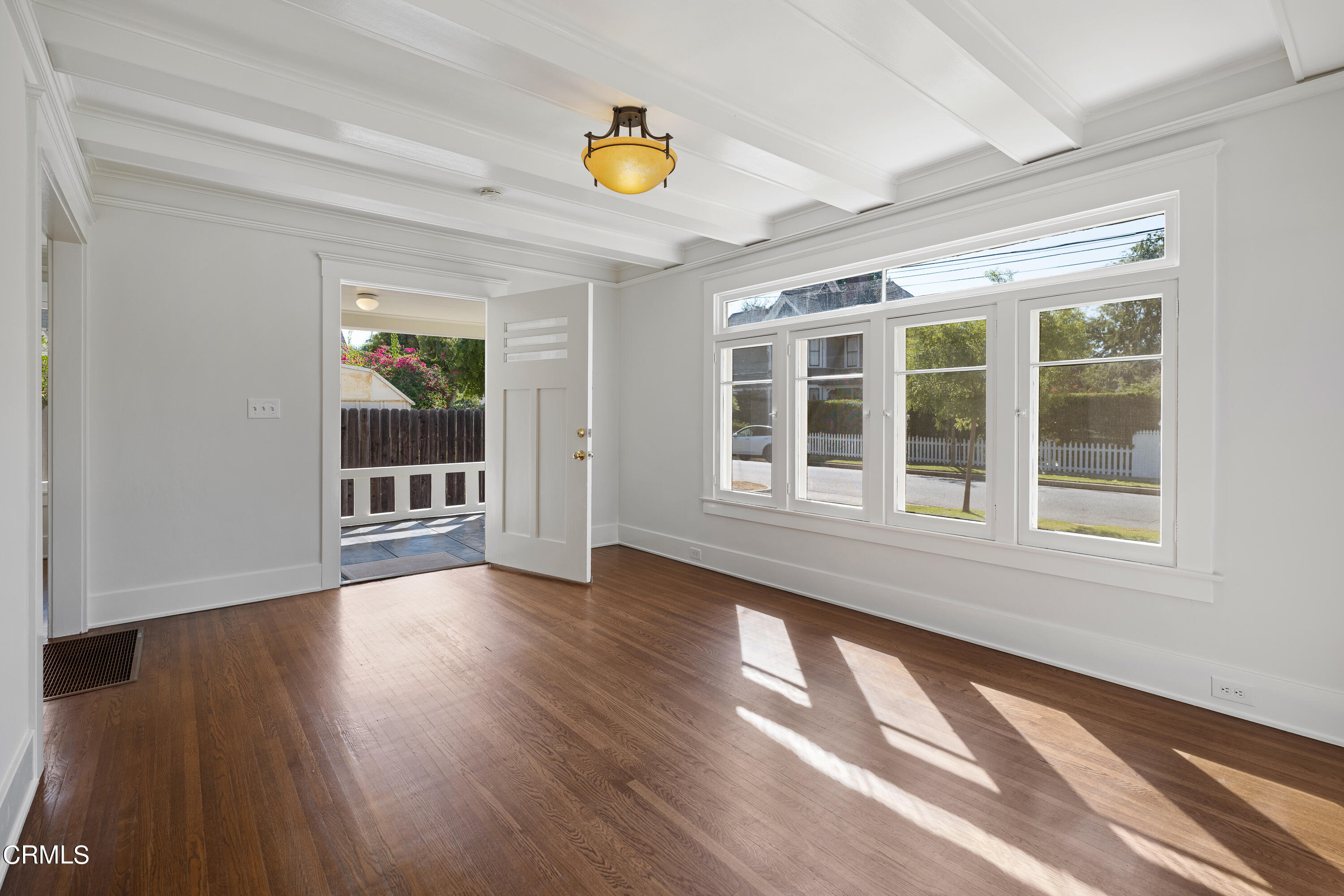 489 Miles Street Pasadena, CA 91106 - Photo 5 of 46 a view of an empty room with wooden floor and a window