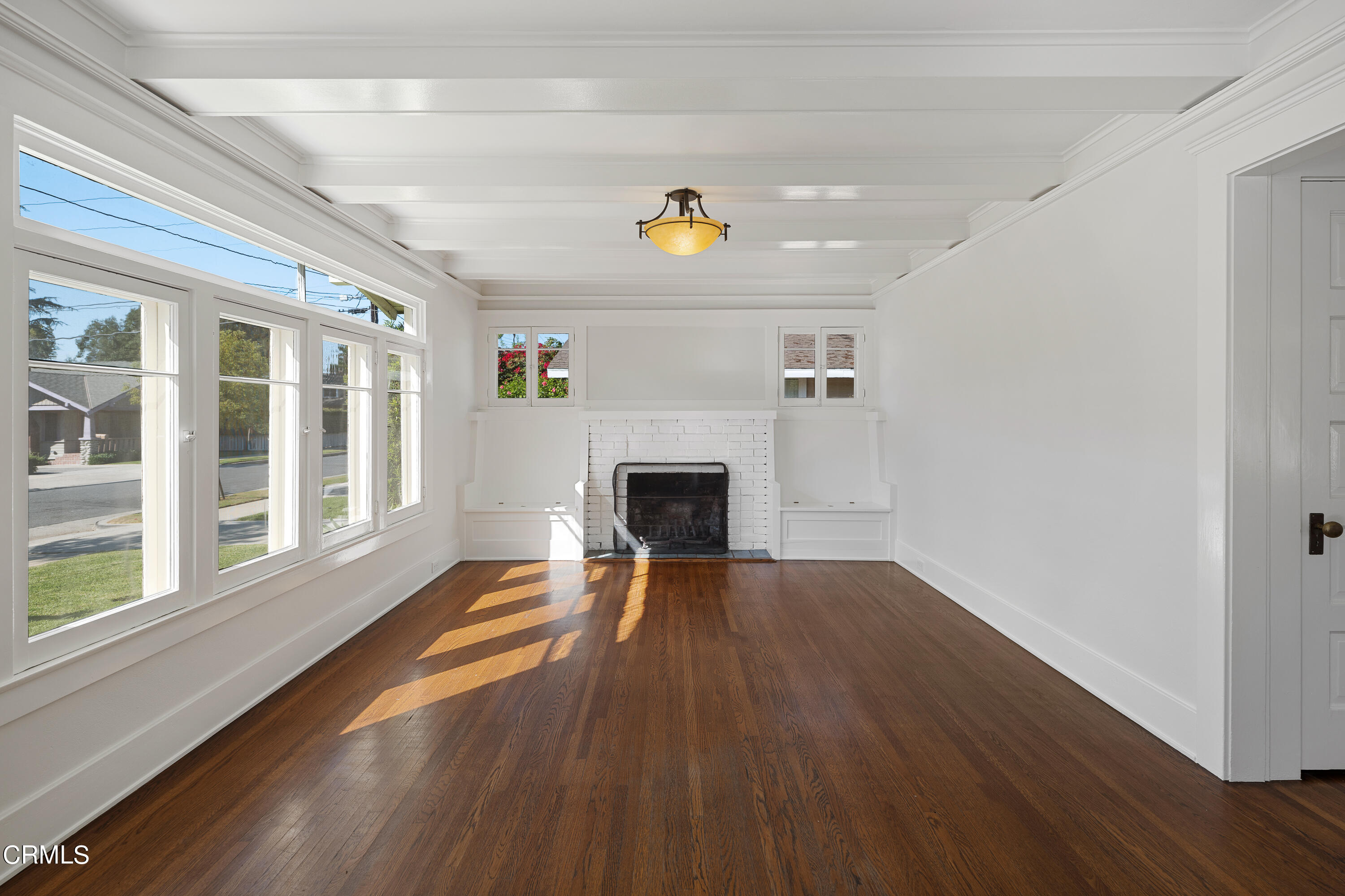 489 Miles Street Pasadena, CA 91106 - Photo 6 of 46 a view of a livingroom with wooden floor and a fireplace