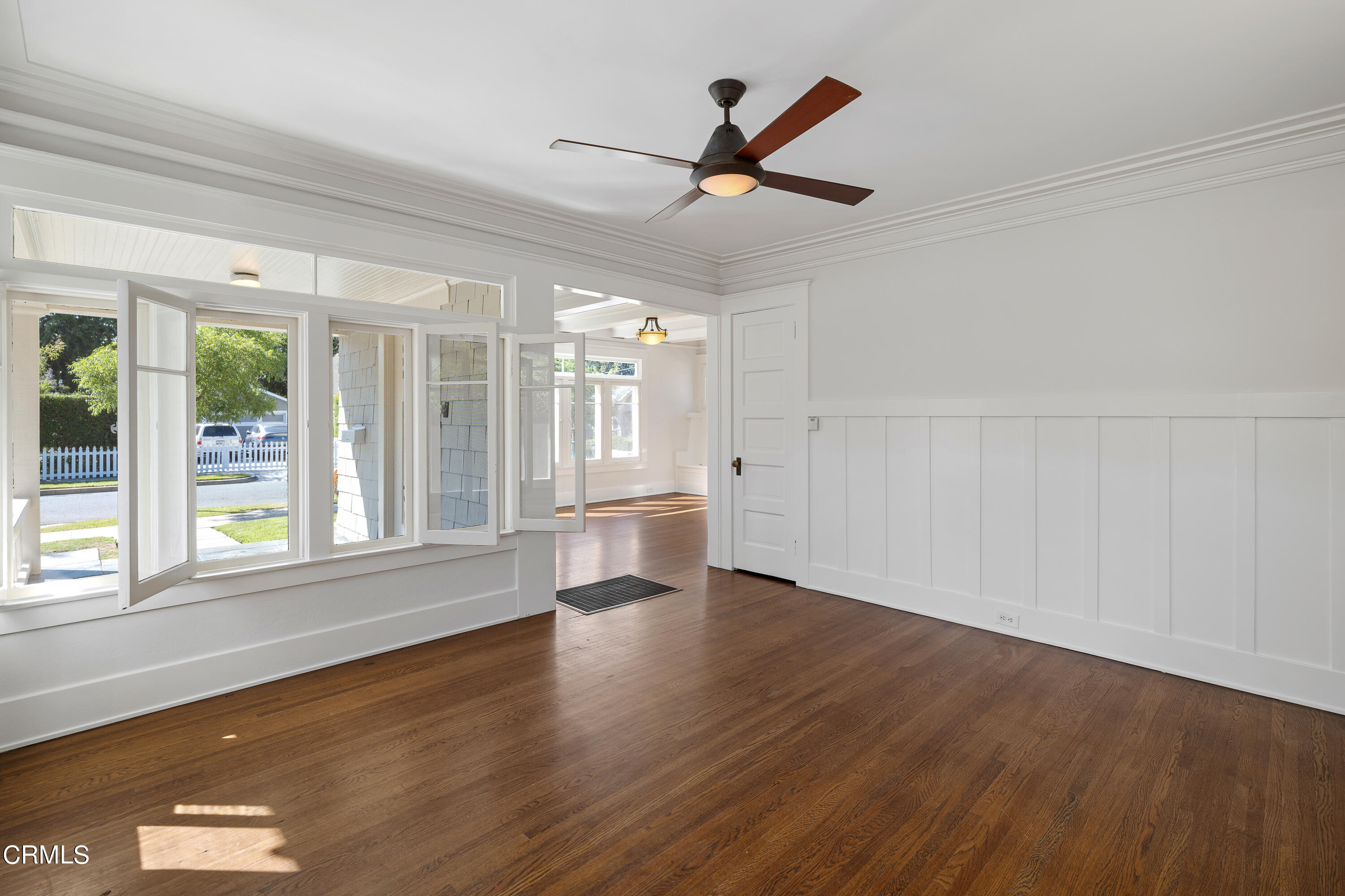 489 Miles Street Pasadena, CA 91106 - Photo 8 of 46 a view of empty room with wooden floor and fan
