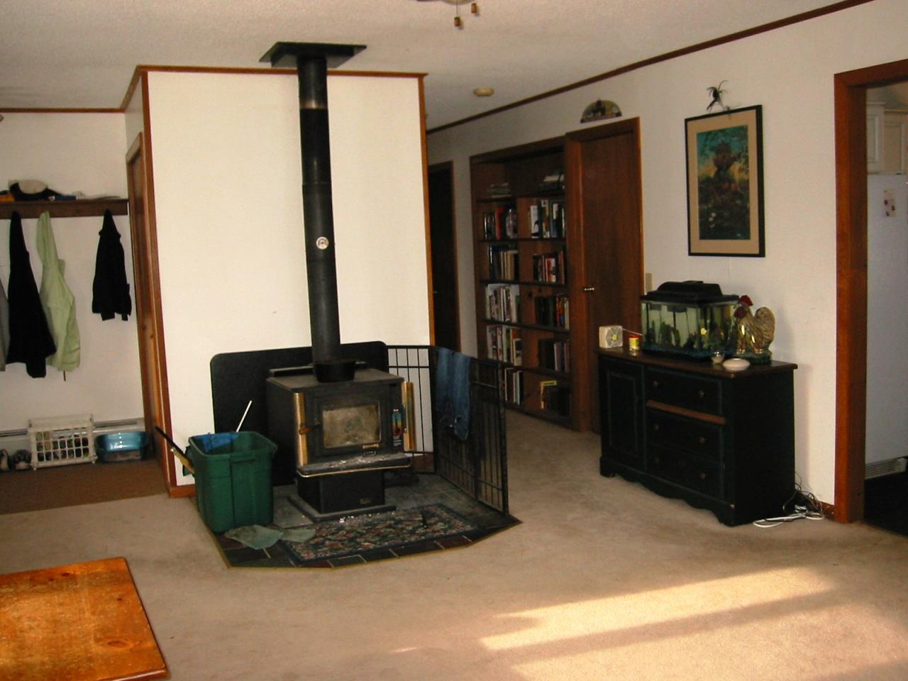 95 East Main Road Peru, MA 01235 - Photo 6 of 18 a living room with furniture gym equipment and a fireplace