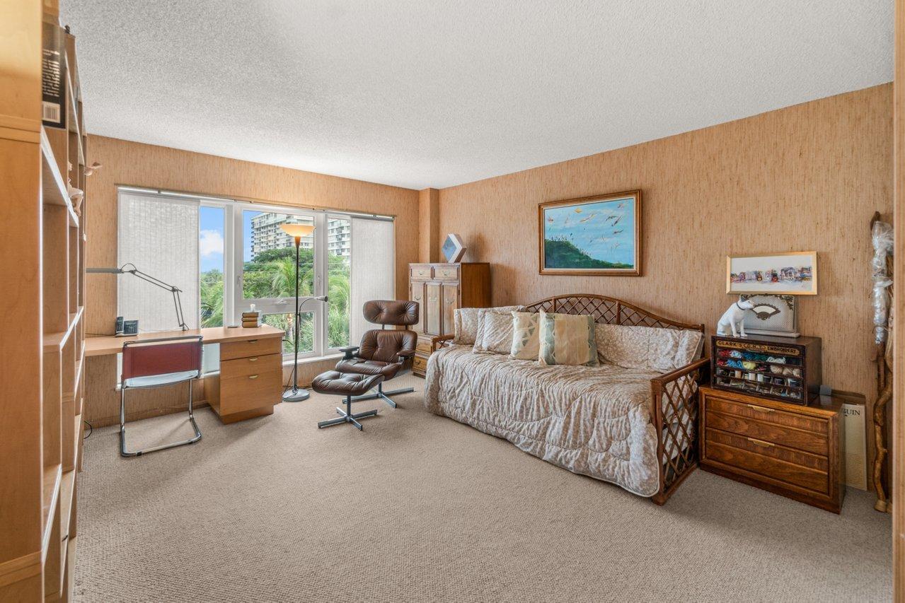 2066 North Ocean Boulevard, Unit 4NW Boca Raton, FL 33431 - Photo 20 of 31 a spacious bedroom with a bed couch and a large window with outer view