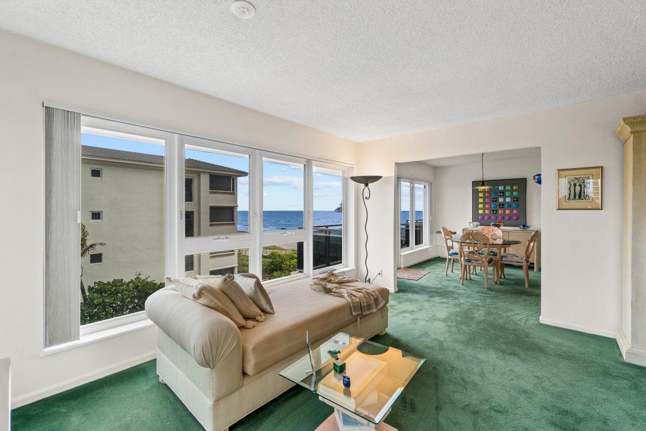 2066 North Ocean Boulevard, Unit 4NW Boca Raton, FL 33431 - Photo 3 of 31 a living room with furniture and a large window