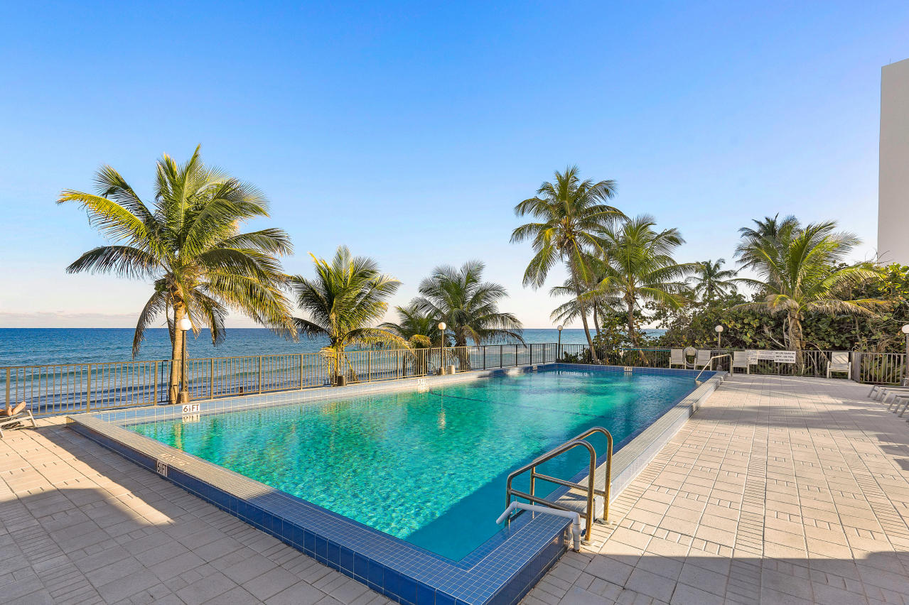 2066 North Ocean Boulevard, Unit 4NW Boca Raton, FL 33431 - Photo 26 of 31 a view of swimming pool with a table and chairs