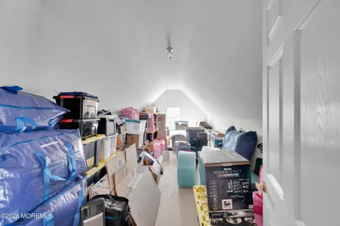 a kitchen with stainless steel appliances a stove a sink a oven a dining table and chairs