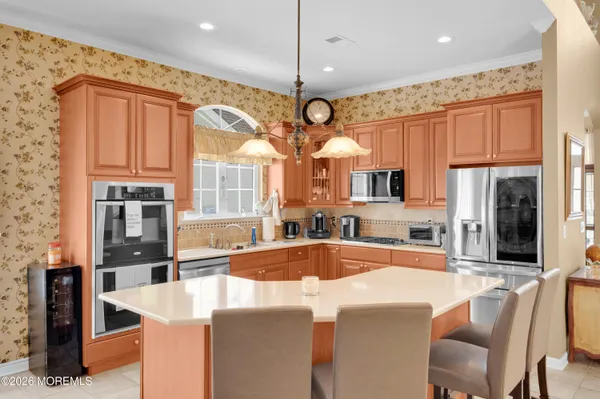 a kitchen with lots of counter top space dining table and chairs