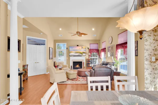 a dining room with furniture and wooden floor