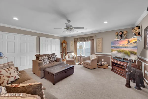 a living room with furniture gym equipment and a window