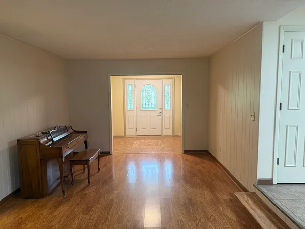a view of a workspace with wooden floor