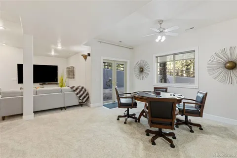 a view of a livingroom with workspace and a couch