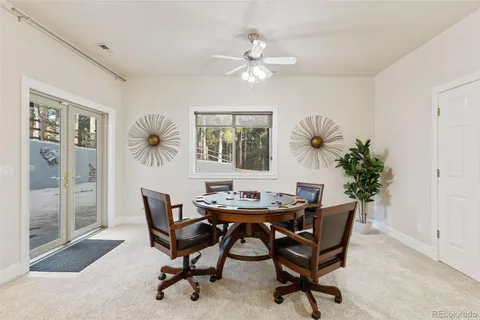 a dining room with furniture and window