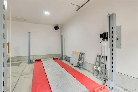 a view of a patio with wooden floor and a yard