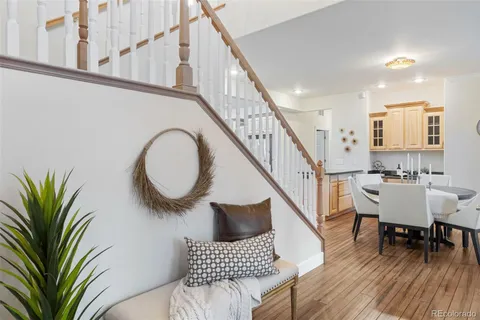 a view of entryway and hall with wooden floor