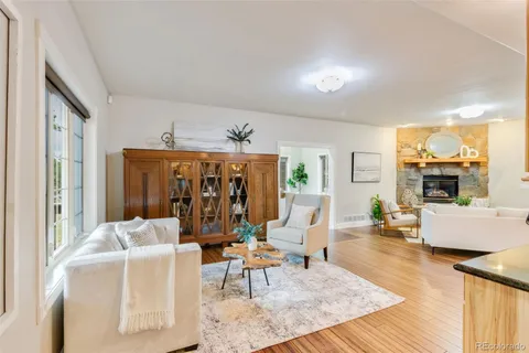 a living room with furniture and large window