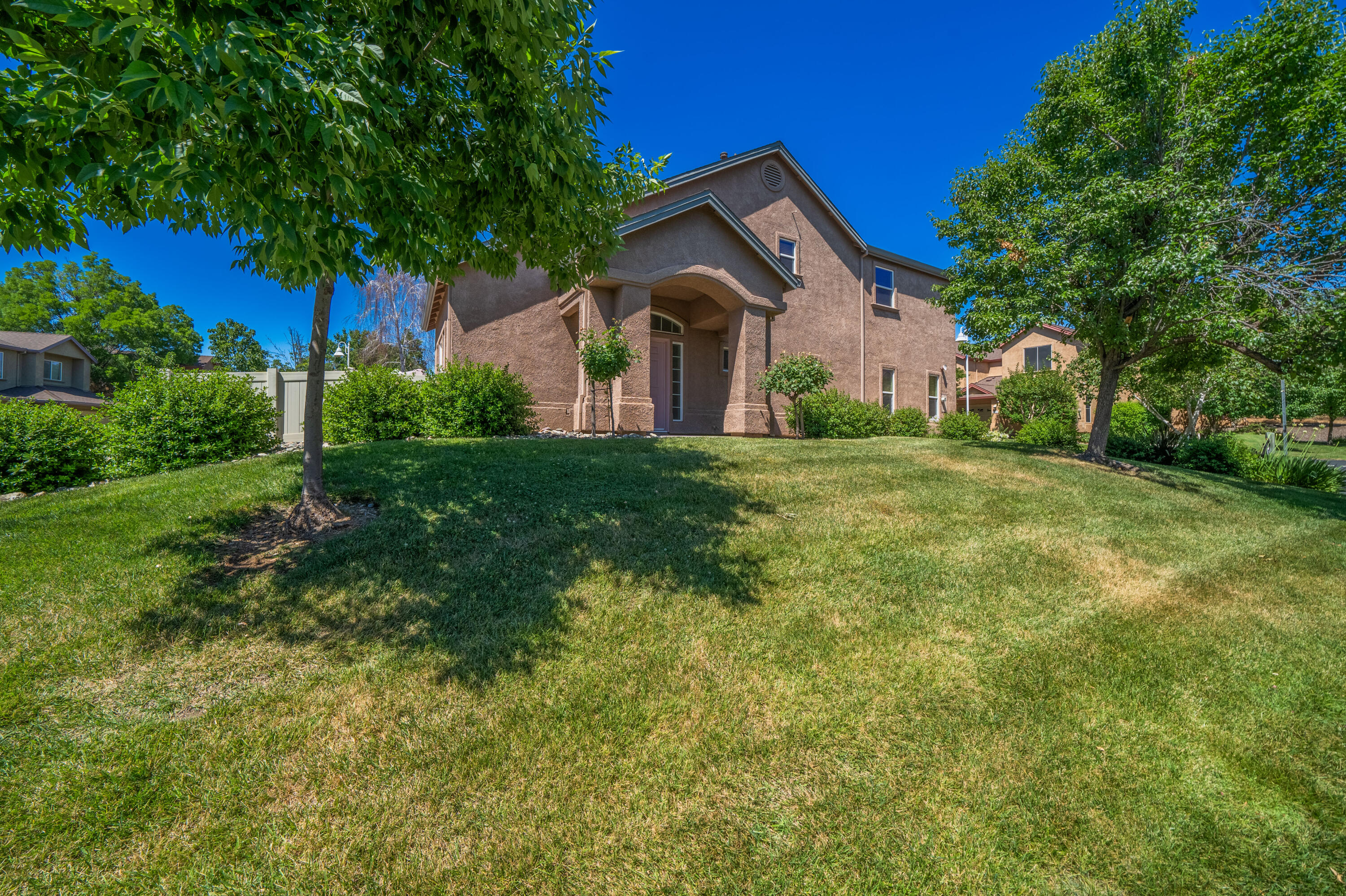 3180 Sinaloa Trail Redding, CA 96002 - Photo 2 of 22 a front view of a house with a yard and trees