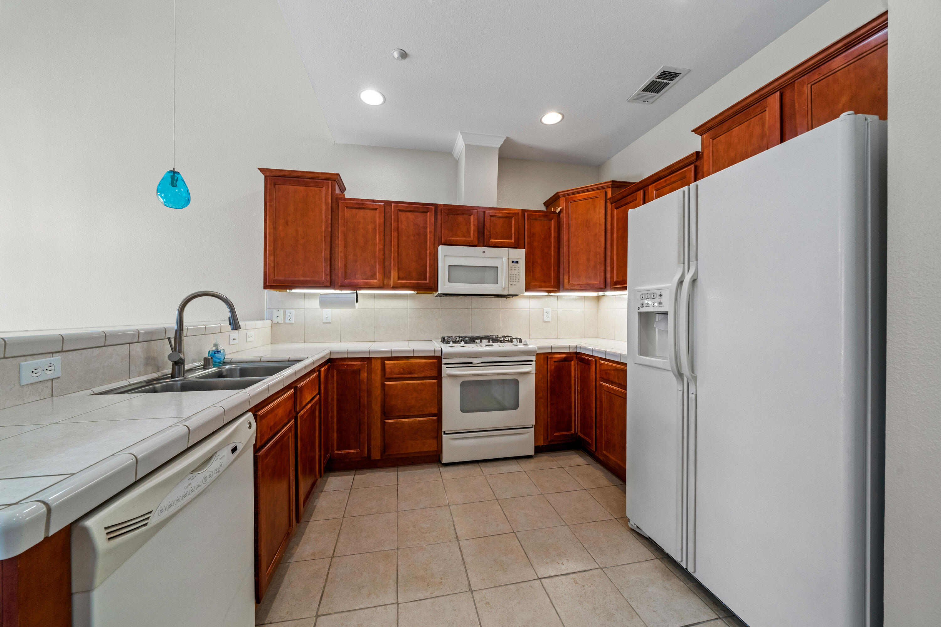 3180 Sinaloa Trail Redding, CA 96002 - Photo 6 of 22 a kitchen with stainless steel appliances granite countertop a sink and a stove top oven