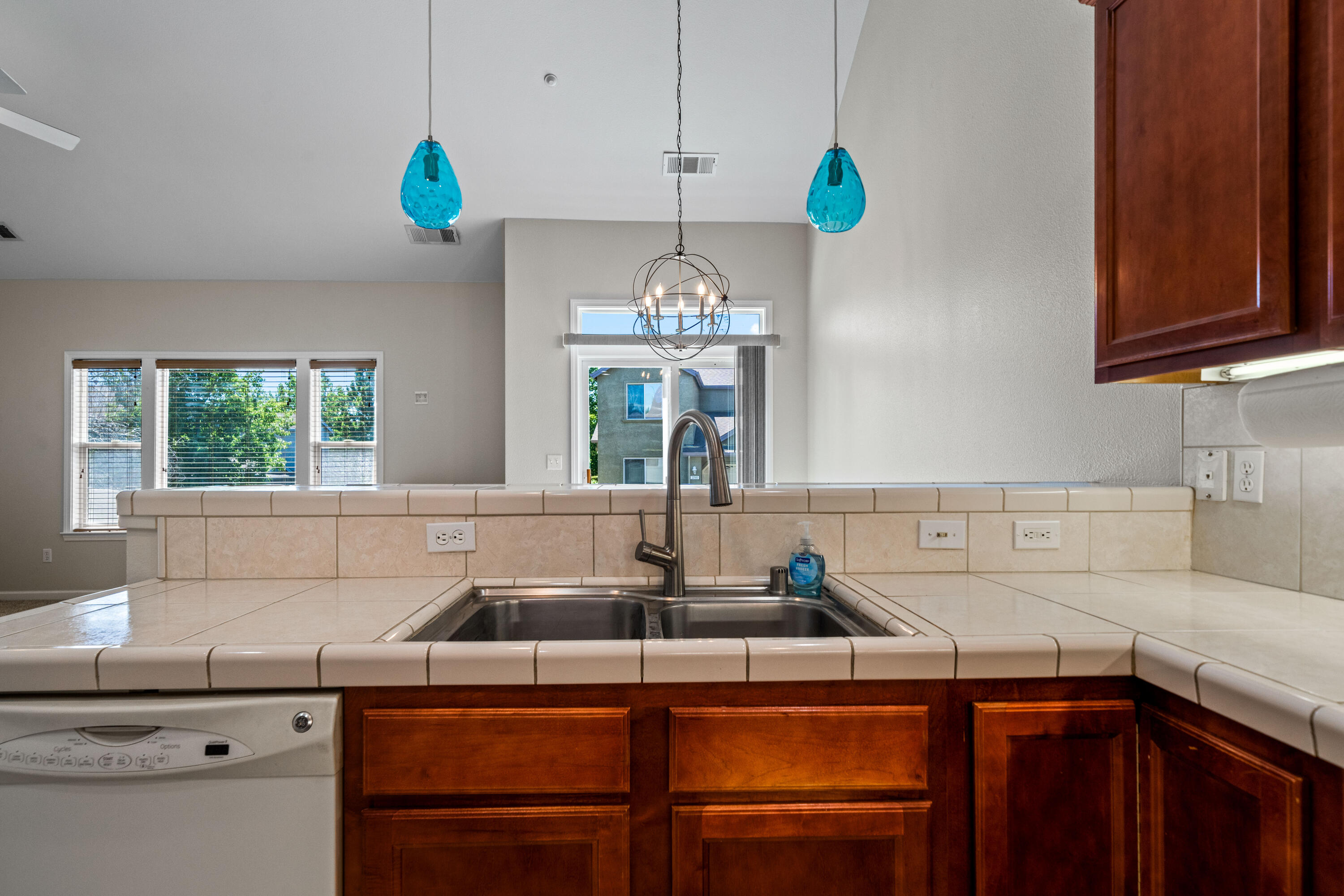 3180 Sinaloa Trail Redding, CA 96002 - Photo 7 of 22 a kitchen with a sink cabinets and window