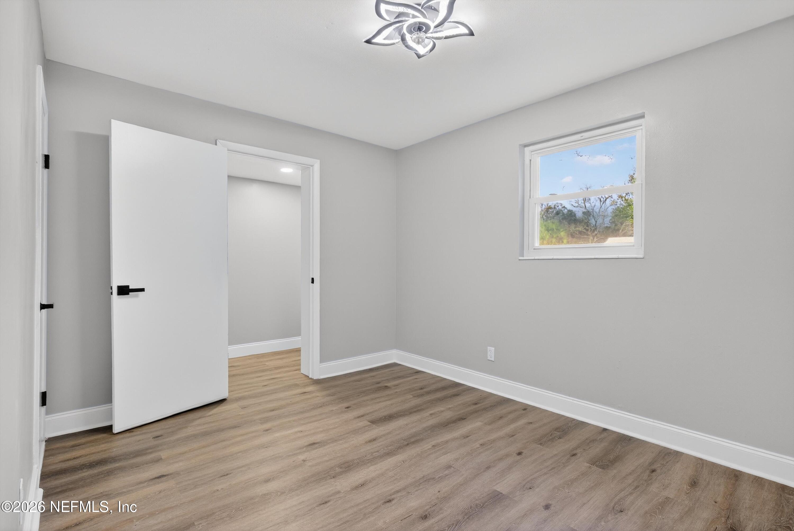 4725 Tango Lane West Jacksonville, FL 32210 - Photo 25 of 54 wooden floor in an empty room