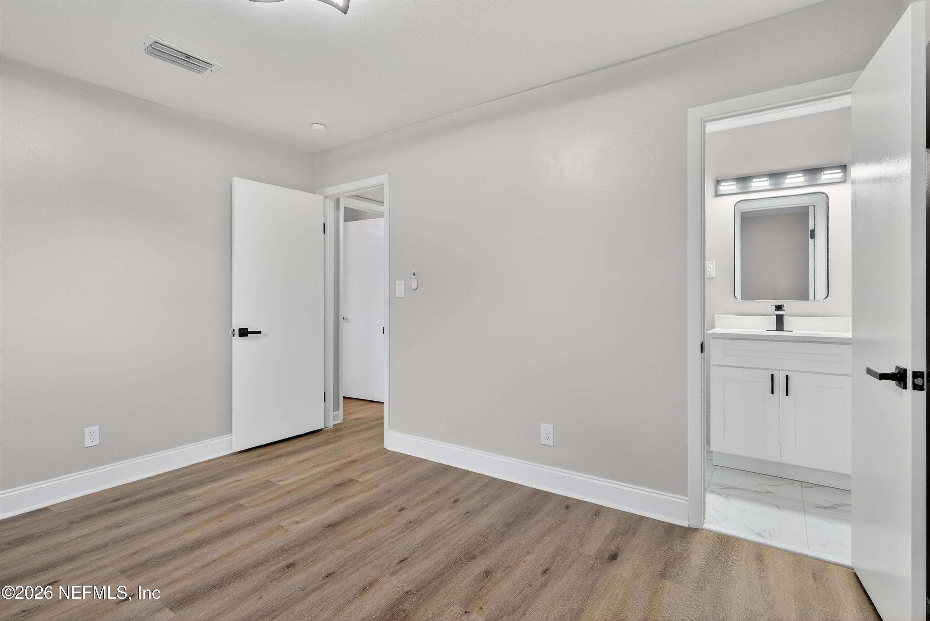 4725 Tango Lane West Jacksonville, FL 32210 - Photo 26 of 54 wooden floor in an empty room