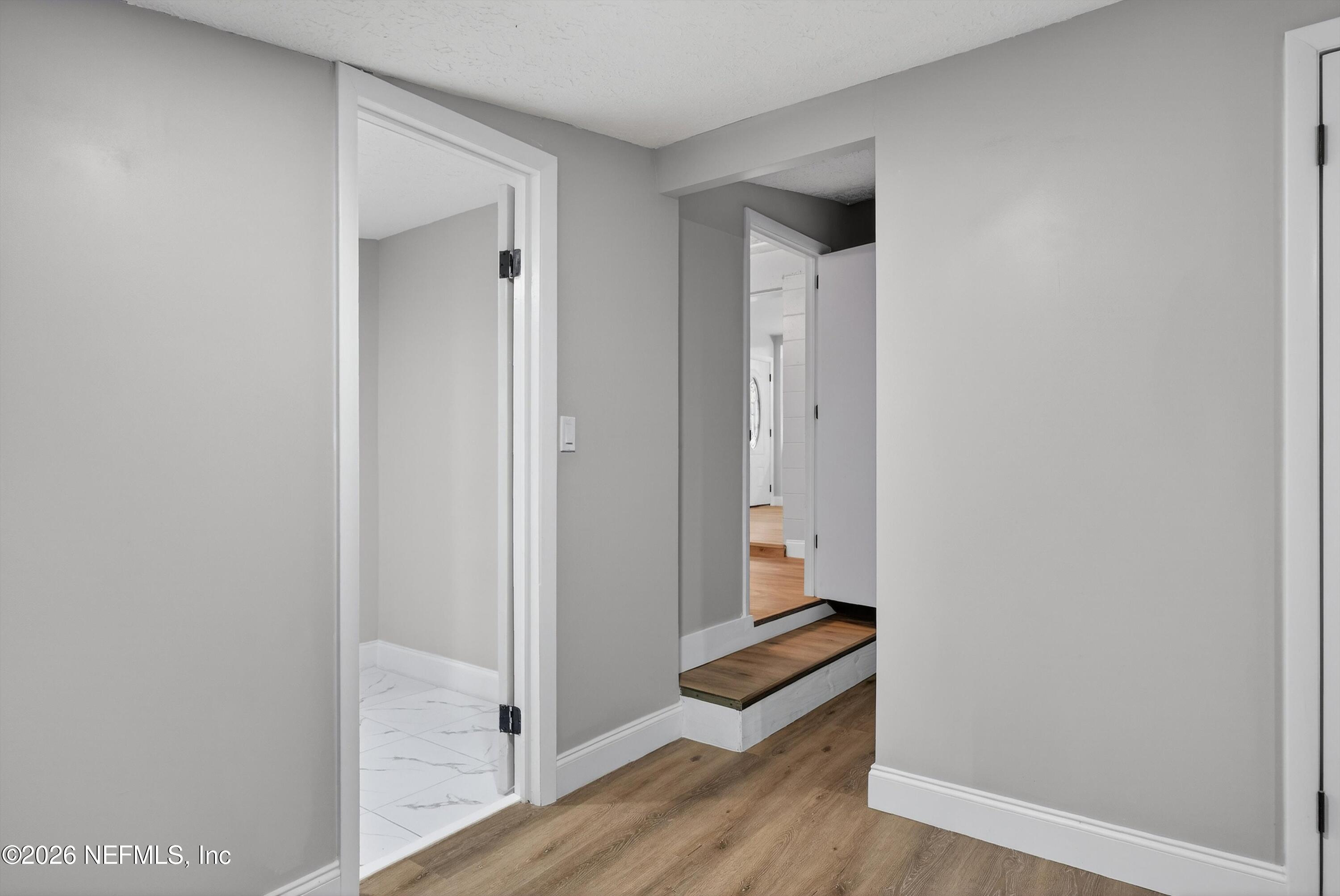 4725 Tango Lane West Jacksonville, FL 32210 - Photo 34 of 54 a view of a hallway with wooden floor