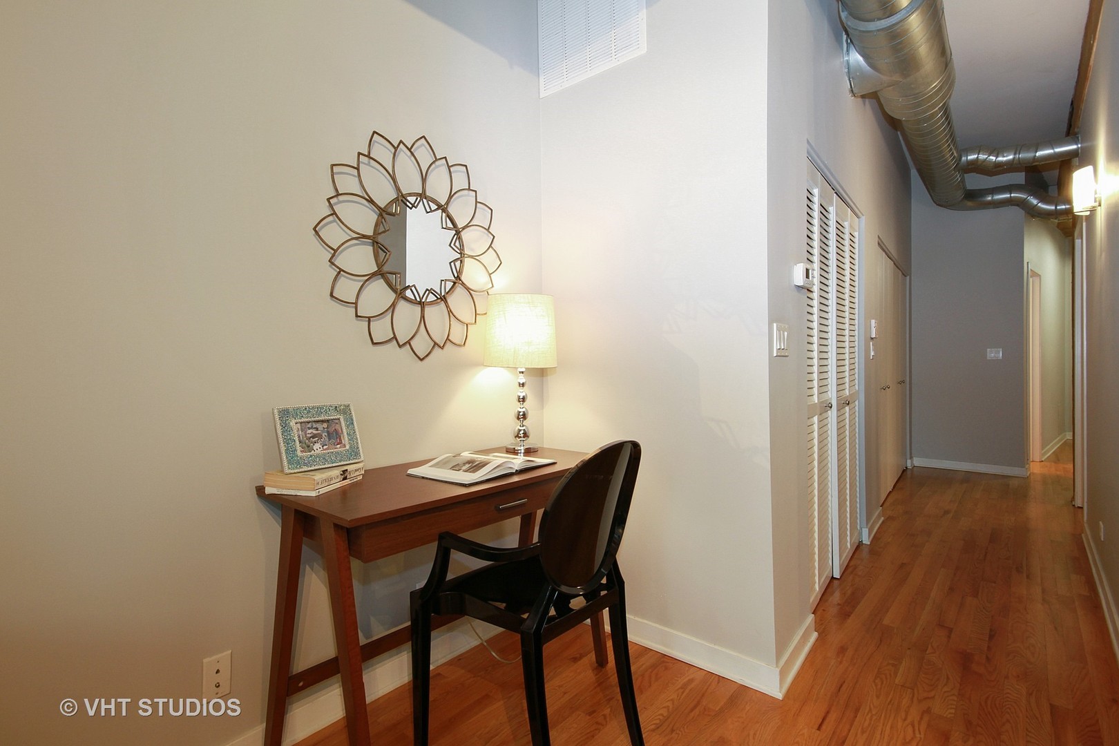 1344 West Madison Street, Unit 201 Chicago, IL 60607 - Photo 4 of 10 a view of a dining room with furniture and wooden floor