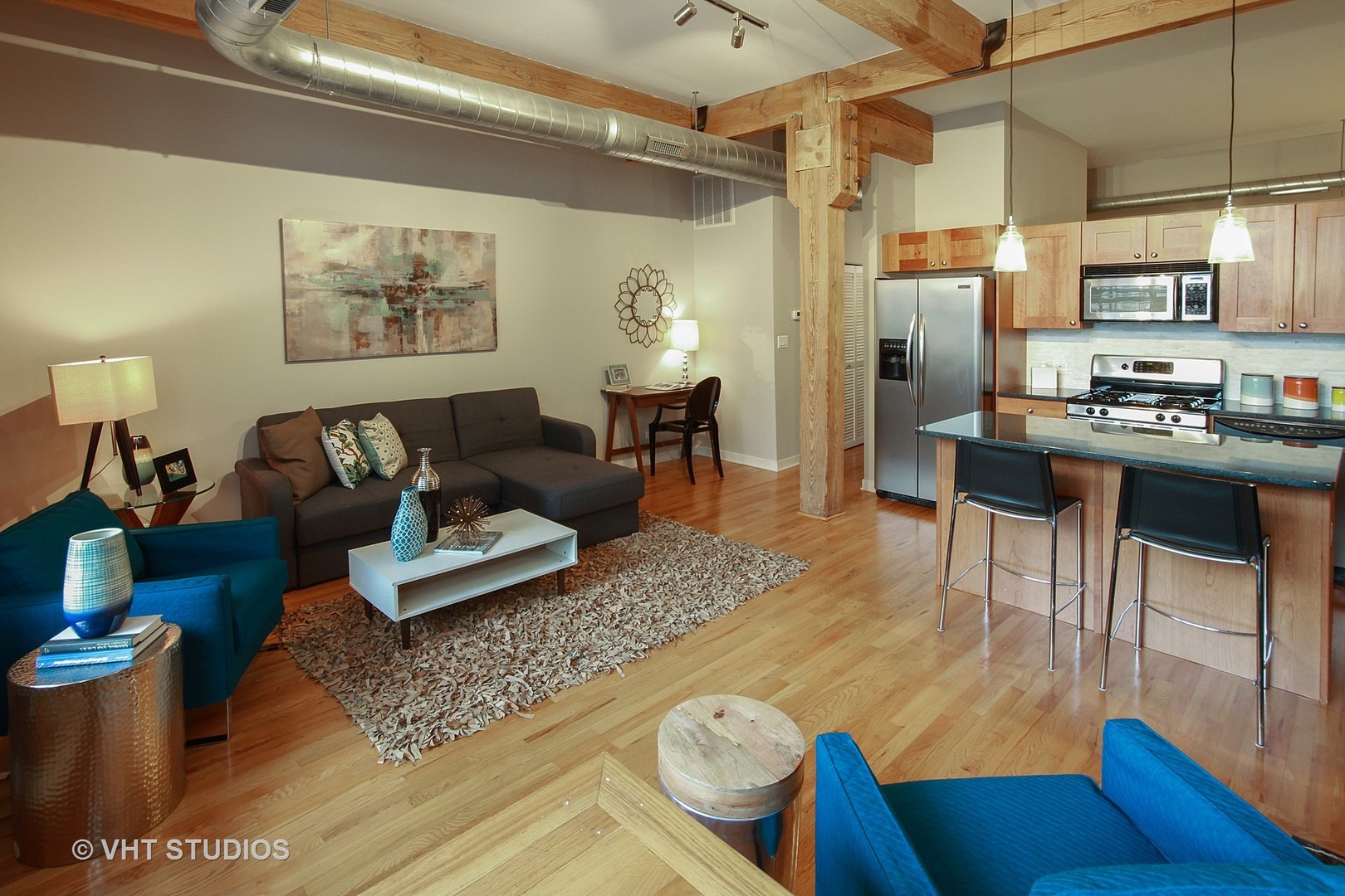 1344 West Madison Street, Unit 201 Chicago, IL 60607 - Photo 5 of 10 a living room with furniture and a table