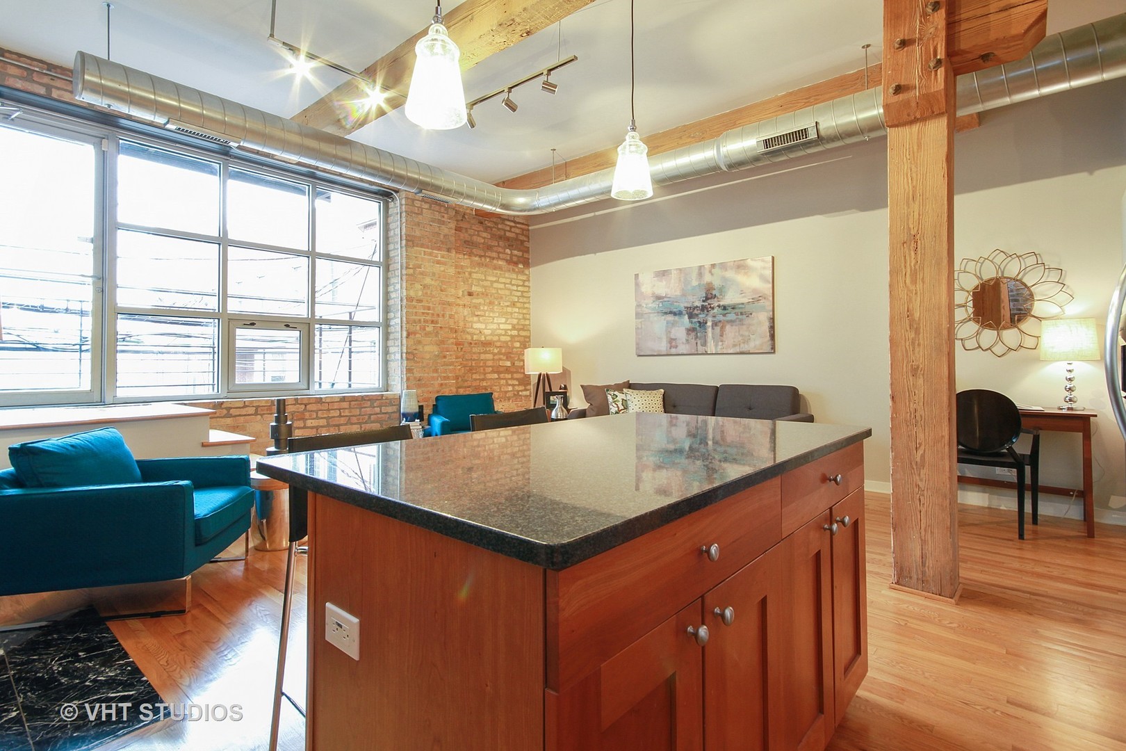 1344 West Madison Street, Unit 201 Chicago, IL 60607 - Photo 6 of 10 a kitchen with stainless steel appliances granite countertop a sink a counter space and a window
