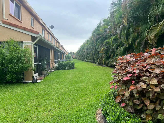 a backyard of a house with lots of green space