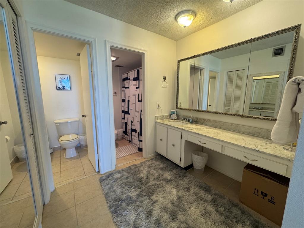 2000 South Ocean Boulevard, Unit 5P Lauderdale-by-the-Sea, FL 33062 - Photo 11 of 34 a spacious bathroom with a tub sink and toilet