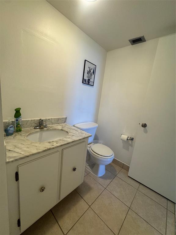 2000 South Ocean Boulevard, Unit 5P Lauderdale-by-the-Sea, FL 33062 - Photo 13 of 34 a spacious bathroom with a granite countertop sink and a toilet
