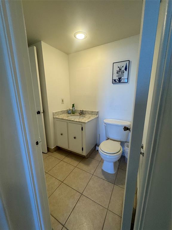 2000 South Ocean Boulevard, Unit 5P Lauderdale-by-the-Sea, FL 33062 - Photo 14 of 34 a bathroom with a toilet sink and mirror