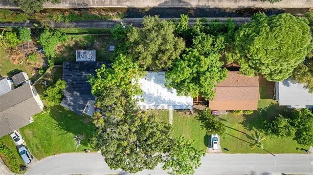 an aerial view of residential houses with outdoor space