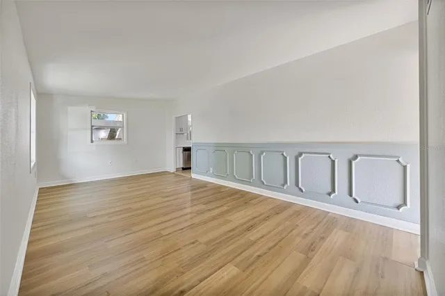 a view of a livingroom with wooden floor