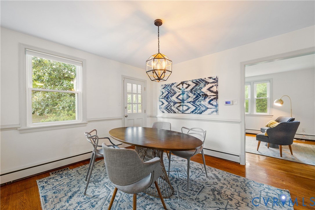 901 Bevridge Road Richmond, VA 23226 - Photo 14 of 43 a dining room with furniture a rug and a chandelier
