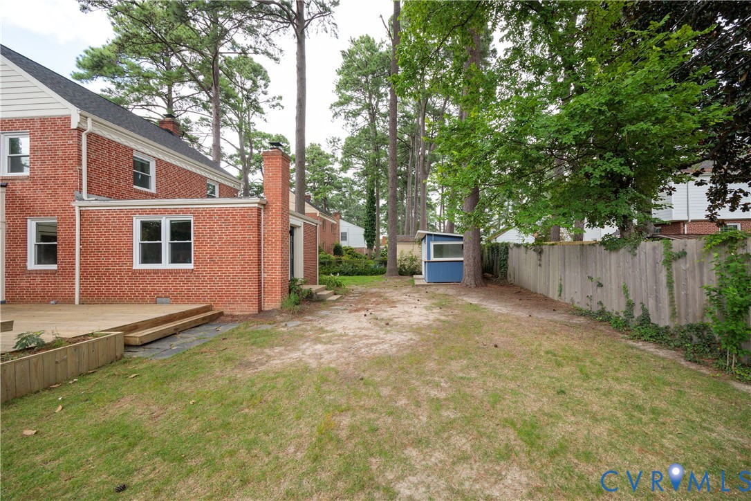 901 Bevridge Road Richmond, VA 23226 - Photo 39 of 43 a backyard of a house with barbeque oven and trees