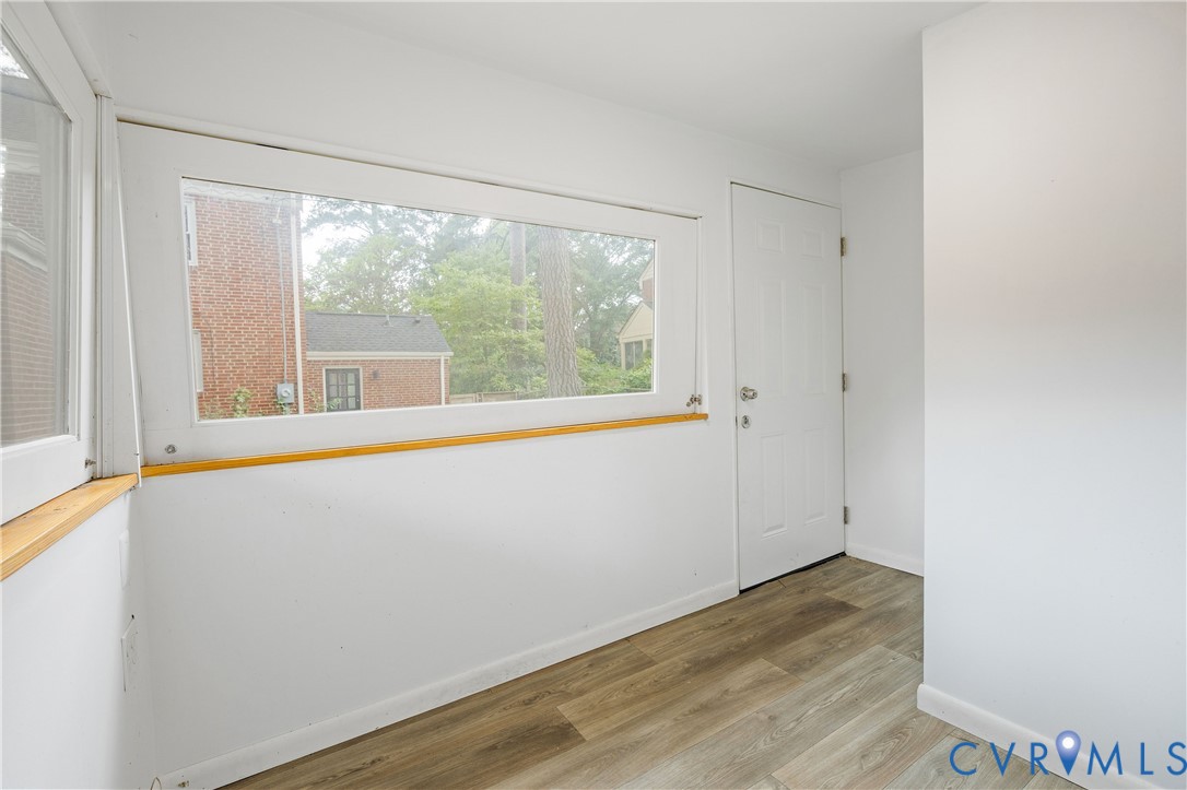 901 Bevridge Road Richmond, VA 23226 - Photo 43 of 43 an empty room with wooden floor and windows