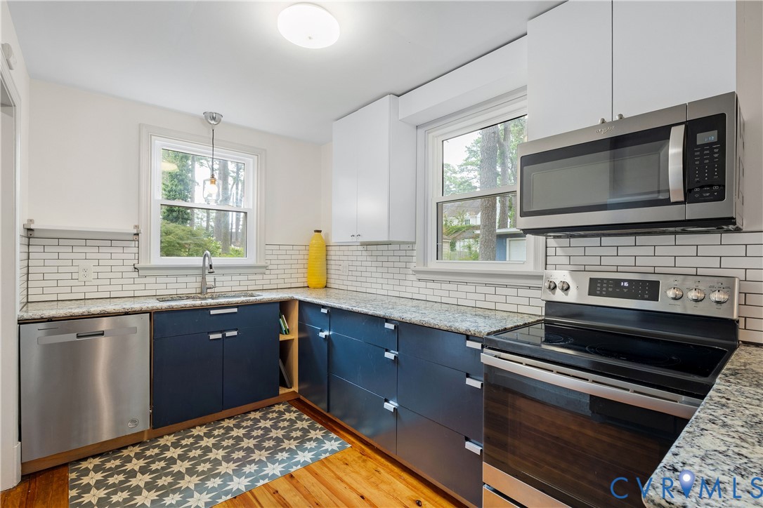 901 Bevridge Road Richmond, VA 23226 - Photo 10 of 43 a kitchen with a stove and a microwave