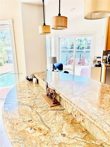 a view of a living room and kitchen