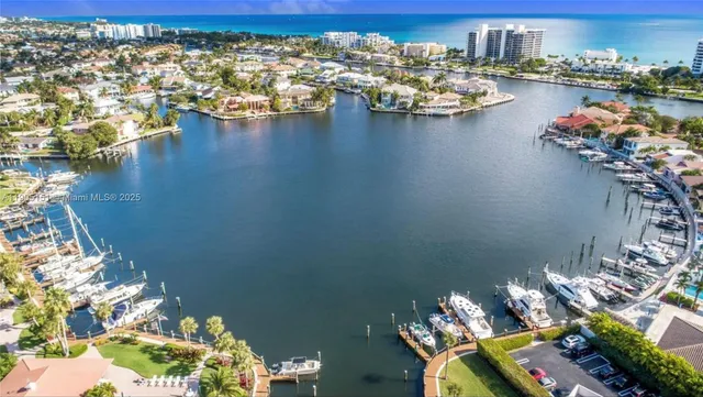 an aerial view of a house with a lake view