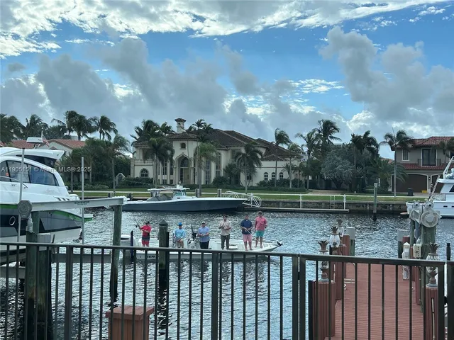 a view of swimming pool with outdoor seating and plants