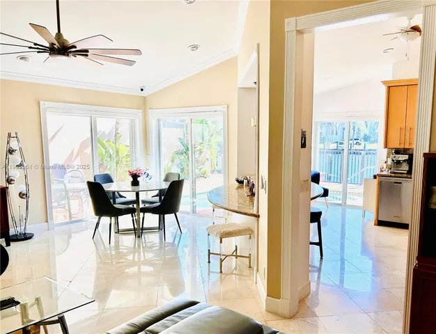 a view of a dining room with furniture window and outside view