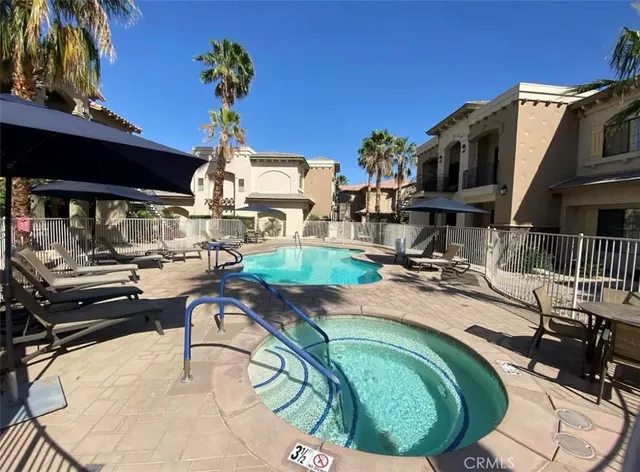 a view of a swimming pool with a patio