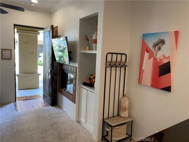a view of a hallway with seating area