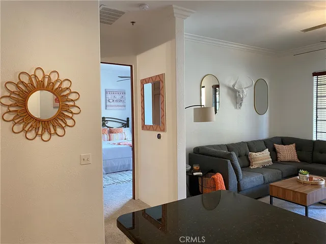 a living room with furniture and a rug