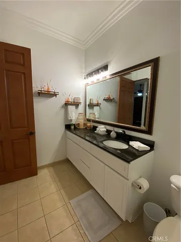 a kitchen with stainless steel appliances a sink and a refrigerator