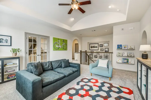 a bathroom with a granite countertop sink a mirror a bathtub and window