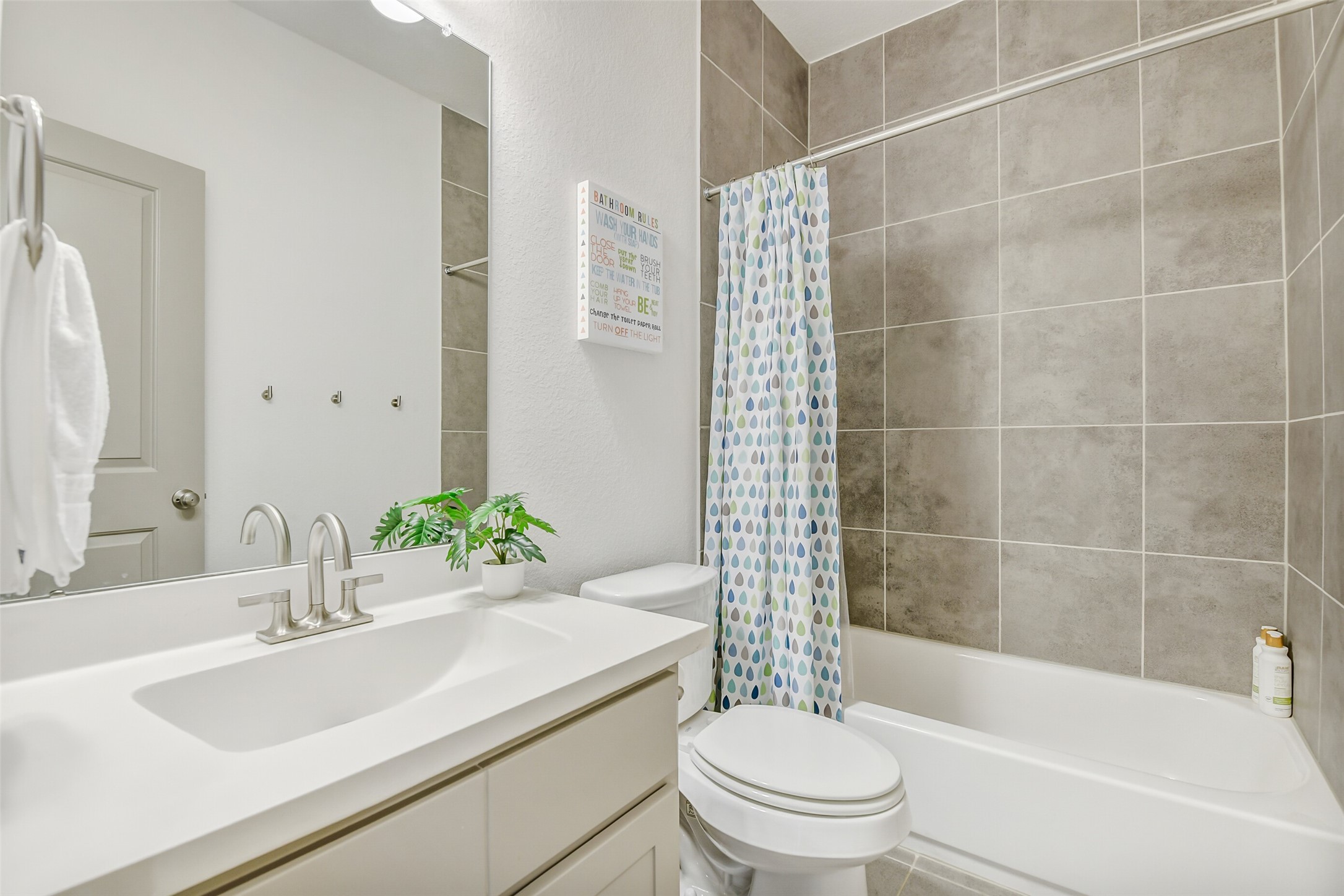 2430 Barclay Lake Lane Spring, TX 77388 - Photo 29 of 50 a bathroom with a sink a toilet and shower