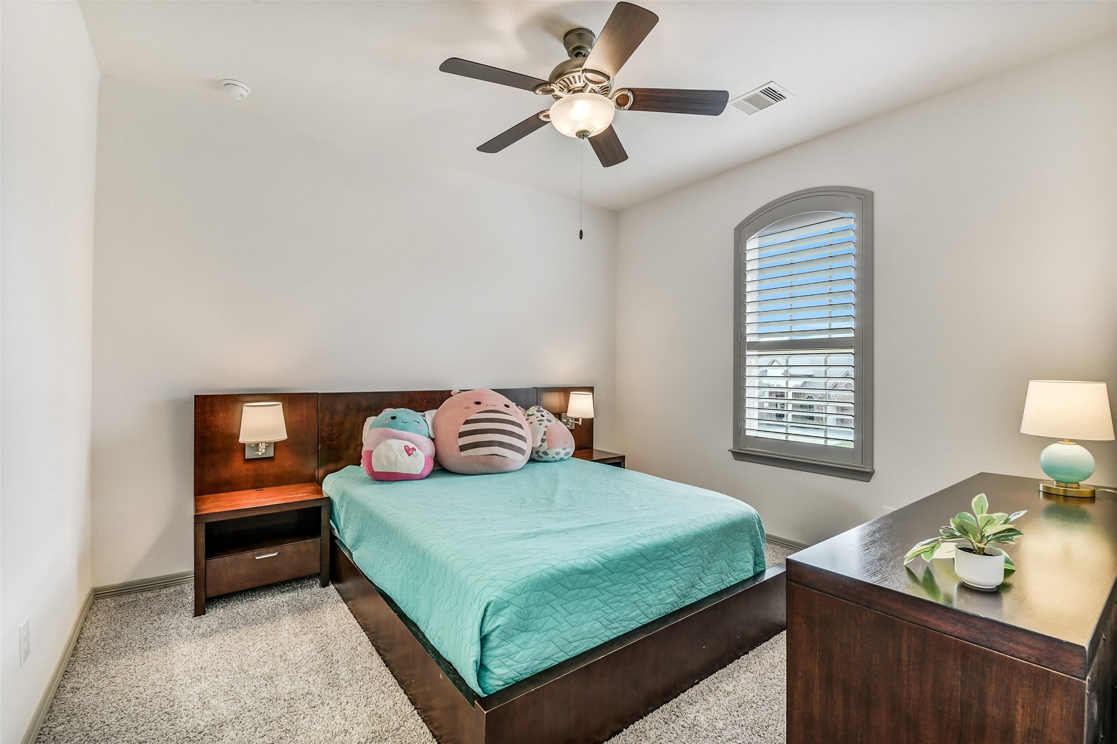 2430 Barclay Lake Lane Spring, TX 77388 - Photo 30 of 50 a bedroom with a bed and a table in it