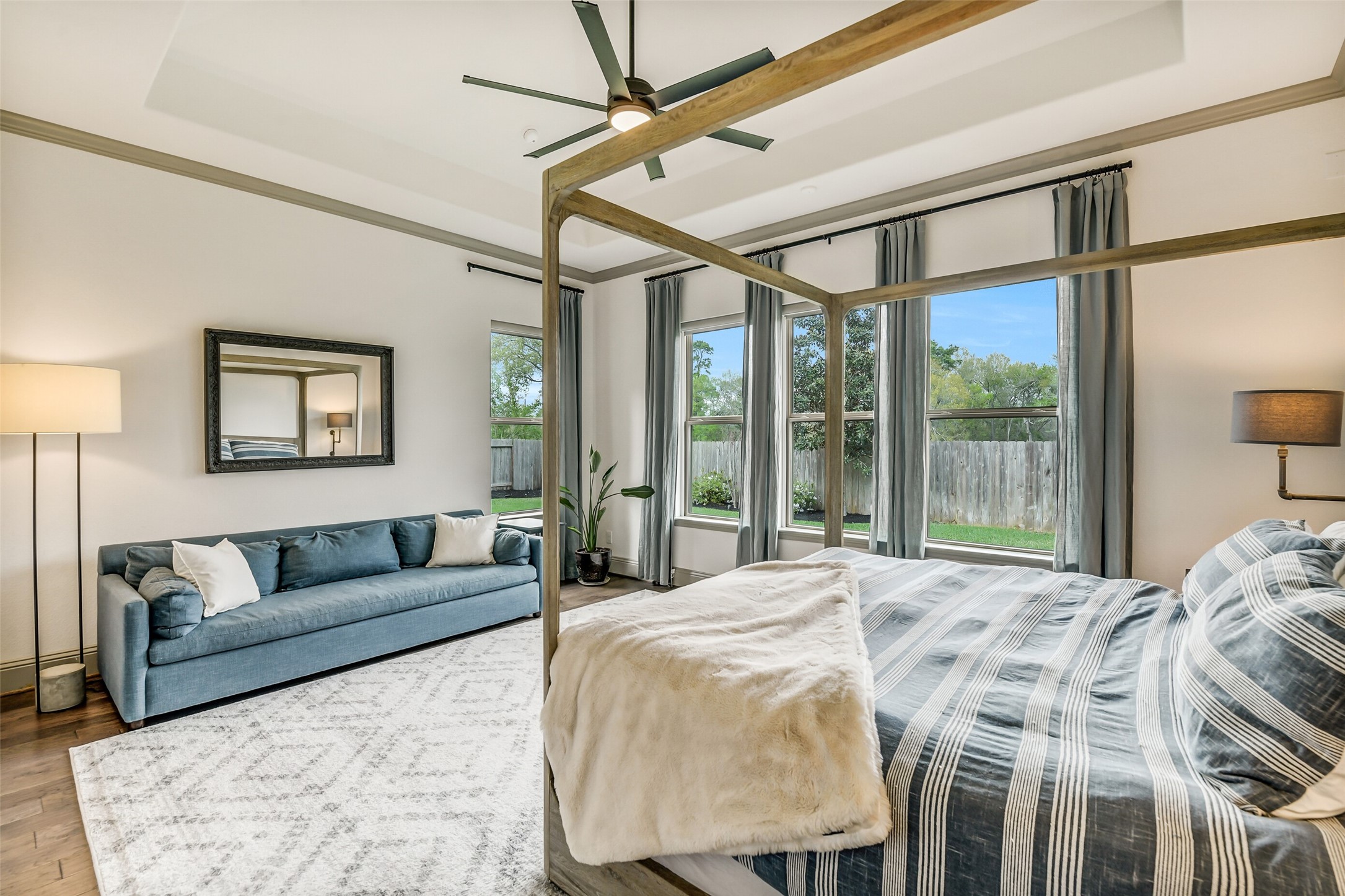 2430 Barclay Lake Lane Spring, TX 77388 - Photo 36 of 50 a spacious bedroom with a bed a couch and a window