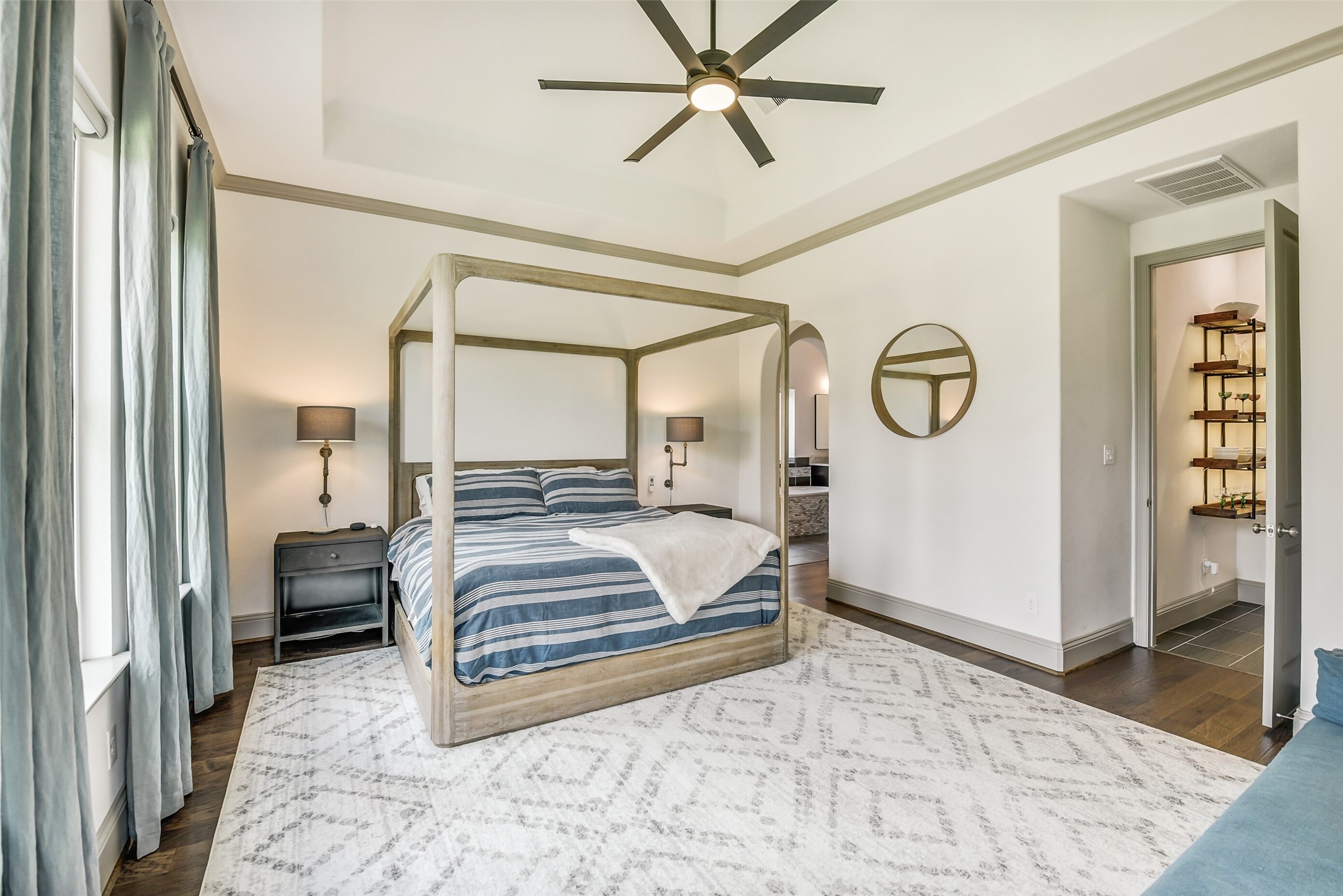 2430 Barclay Lake Lane Spring, TX 77388 - Photo 37 of 50 a bedroom with a large bed and a chandelier