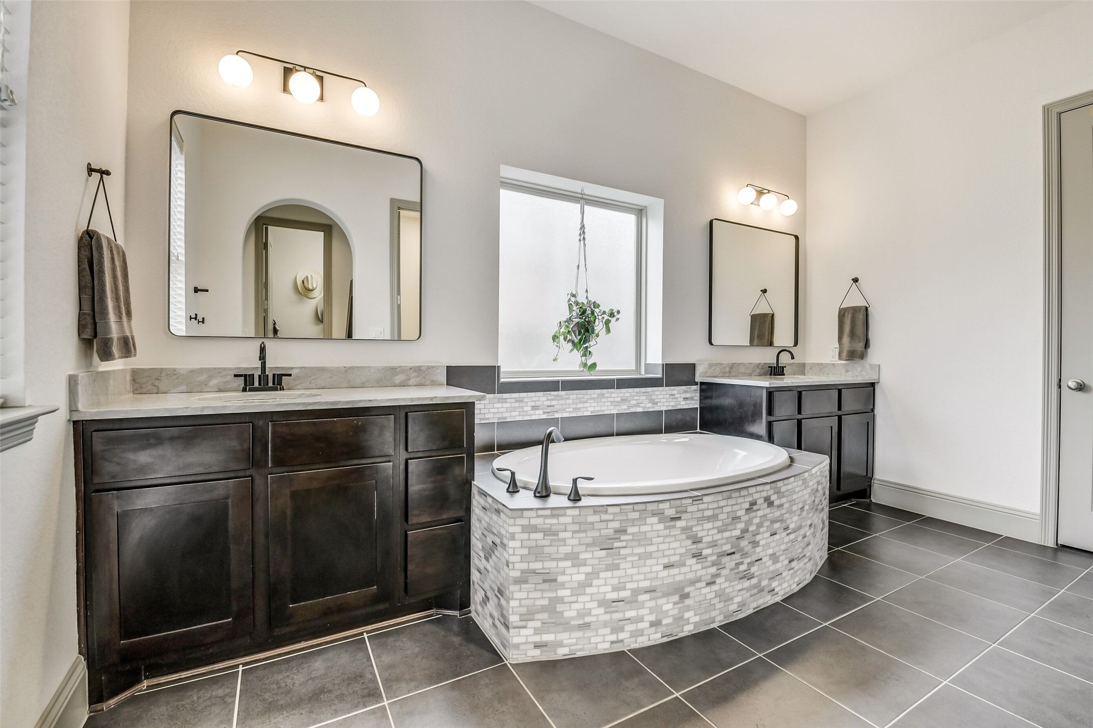 2430 Barclay Lake Lane Spring, TX 77388 - Photo 41 of 50 a bathroom with a granite countertop sink a mirror and a bathtub